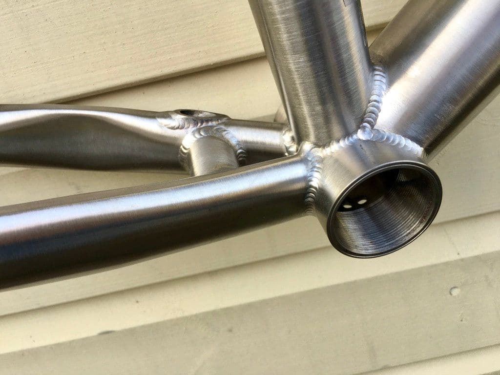 A close-up of a titanium weld at the bottom bracket