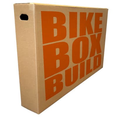 A cardboard bike box printed with the words Bike Box Build