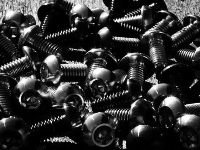 A pile of titanium bolts
