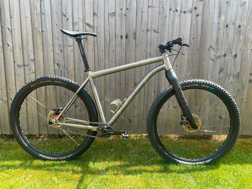 Travers Angus titanium singlespeed mountain bike with EVO Prong carbon fork.Picture